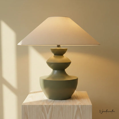 Sage green sculpted wooden table lamp with linen shade — handcrafted solid wood table lamp Wood Evoke Pakistan