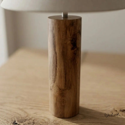 Lilac wooden table lamp lifestyle shot — natural wood cylinder lamp with soft fabric shade Wood Evoke