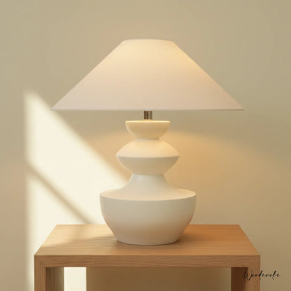 White sculpted wooden table lamp with minimalist linen shade — handcrafted table lamp Wood Evoke Pakistan