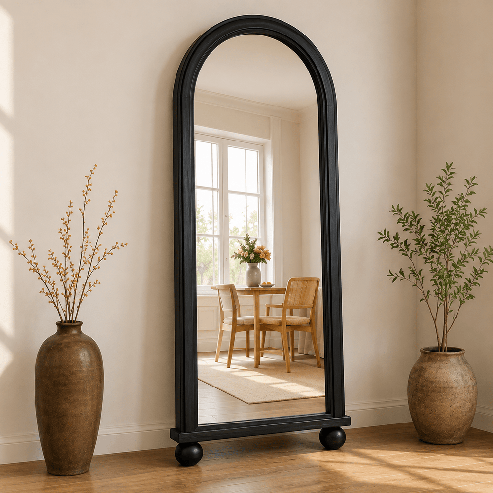 Black arched floor mirror with ball feet and moulded wooden frame by Wood Evoke