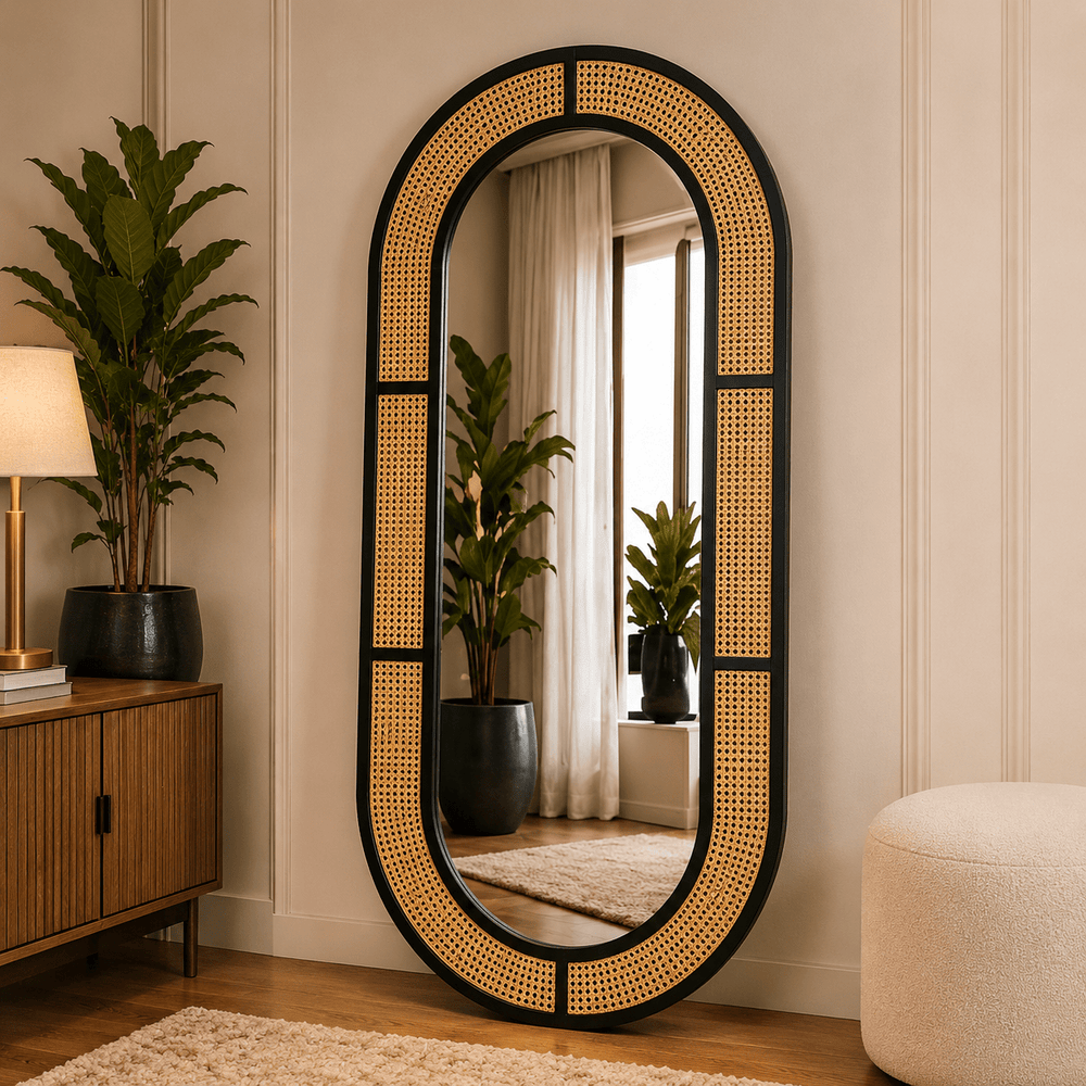 Capsule shaped rattan cane floor mirror with black wooden frame by Wood Evoke