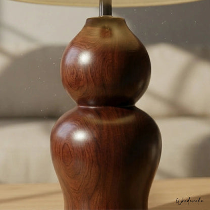 Brown wooden table lamp with warm glow — solid natural wood lamp with linen shade Wood Evoke