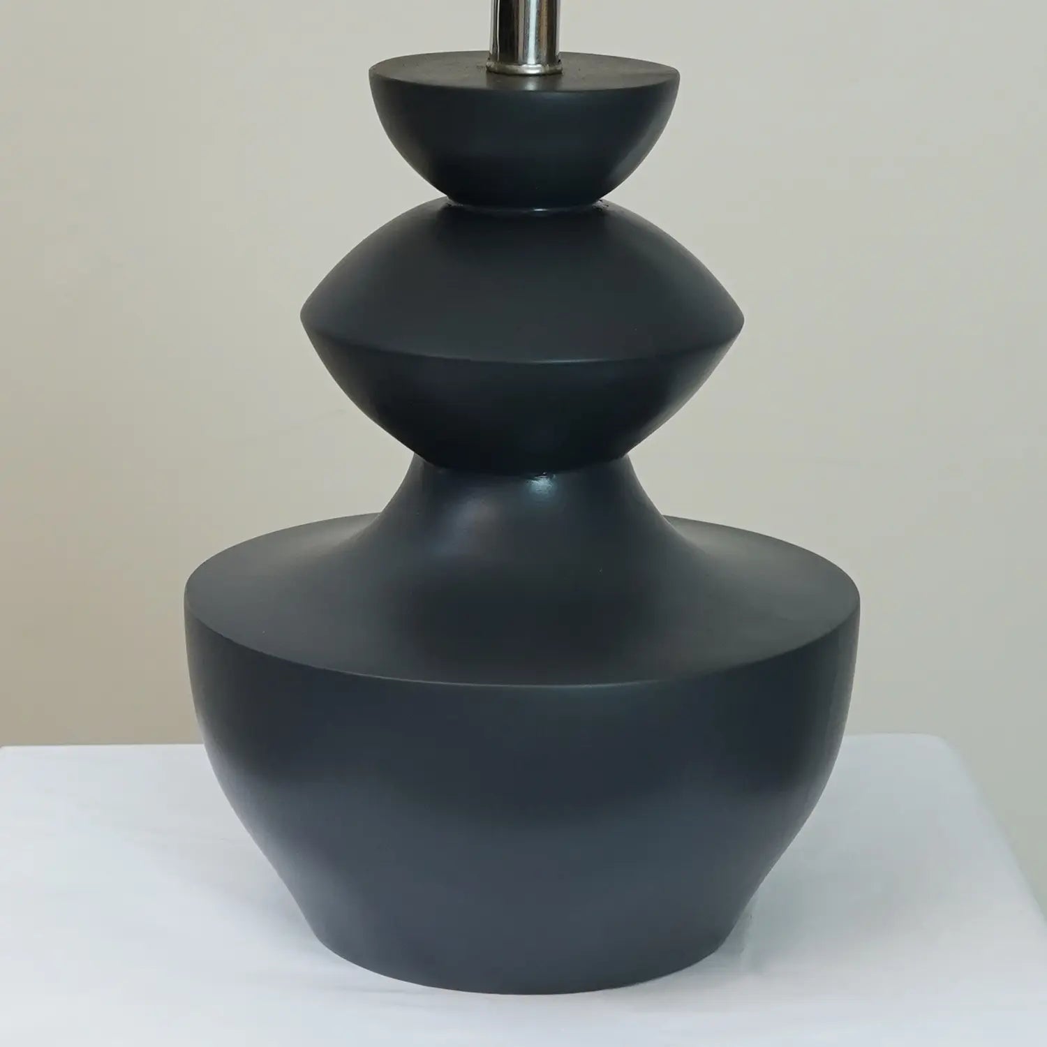 Grey sculpted wooden table lamp lifestyle — solid wood table lamp for drawing rooms Pakistan