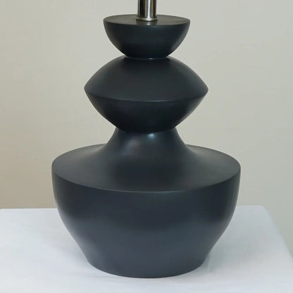 Grey sculpted wooden table lamp lifestyle — solid wood table lamp for drawing rooms Pakistan